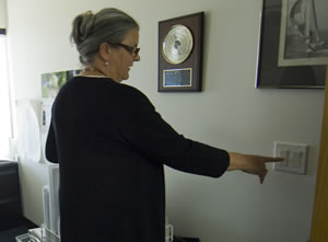 Photo of an employee turning of her office lights.